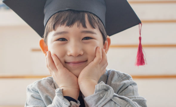 A child in a graduation cap