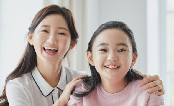 A couple of women smiling