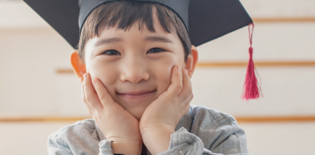 A child in a graduation cap